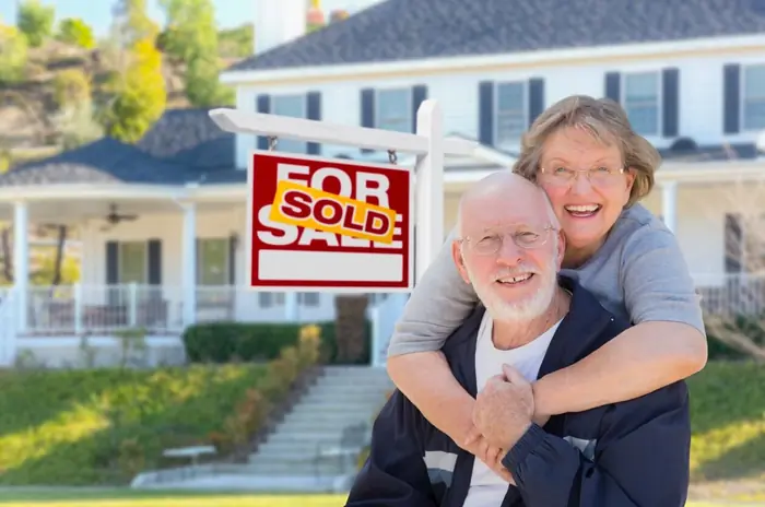 Family outside a house they sold